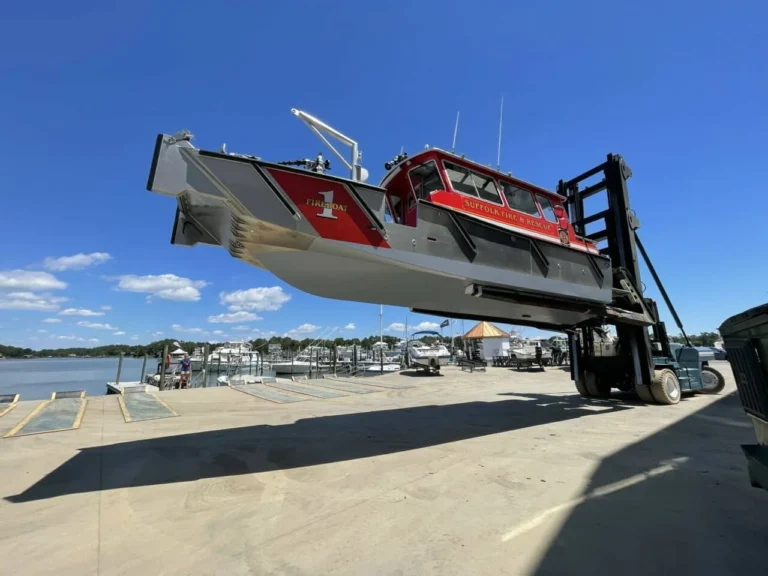A boat lifted by a forklift at Legasea Marine’s Yorktown service facility.